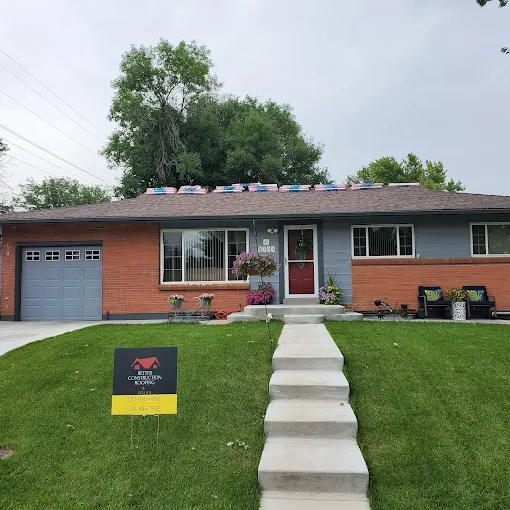 White gable-roof residential home with dark shingles suitable for hail damage roof inspection – Chicago Hail Claims.