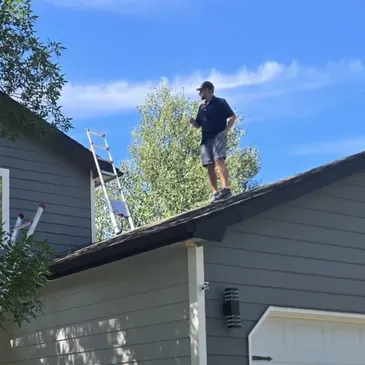 Roofing contractor performing hail and storm damage roof repairs on a residential home – Chicago Hail Claims.